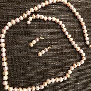 Fresh water cultured pearl necklace and earrings.